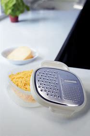 STAINLESS GRATER WITH STORAGE COMPARTMENT